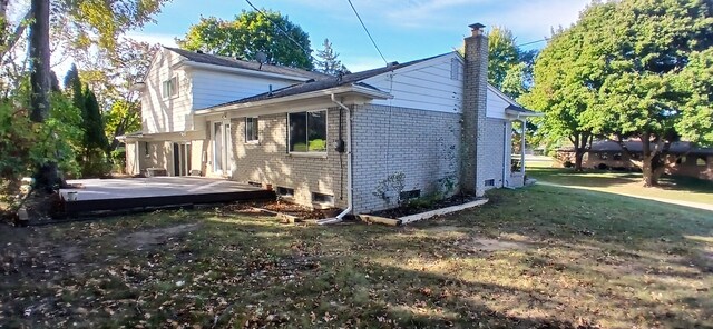 view of home's exterior featuring a patio area and a yard