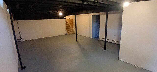 basement featuring a baseboard heating unit