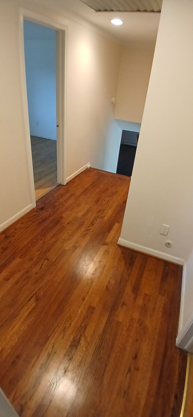 spare room with dark hardwood / wood-style floors