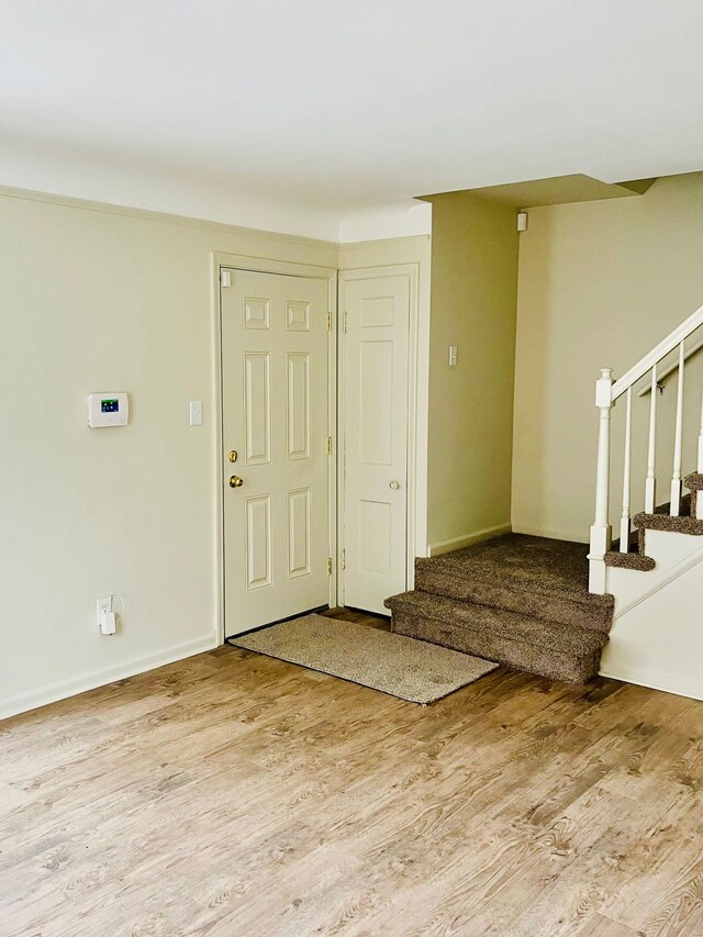 entryway with light hardwood / wood-style floors