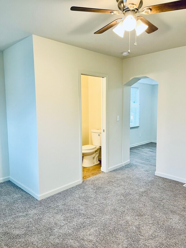 empty room with carpet flooring and ceiling fan