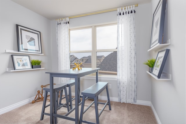 view of carpeted dining space