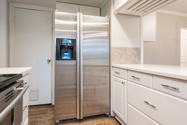 kitchen with white cabinetry, light wood-type flooring, stainless steel fridge with ice dispenser, and ornamental molding