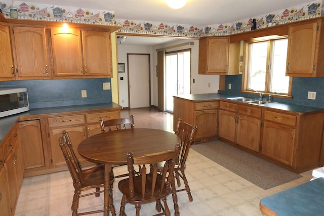 kitchen with tasteful backsplash and sink