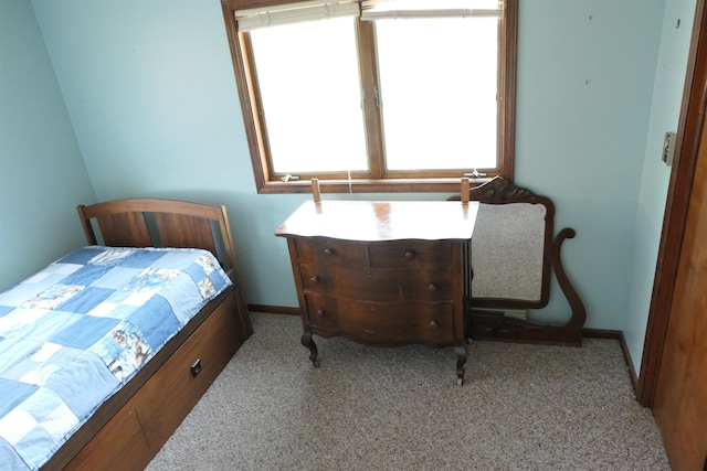 bedroom featuring light colored carpet