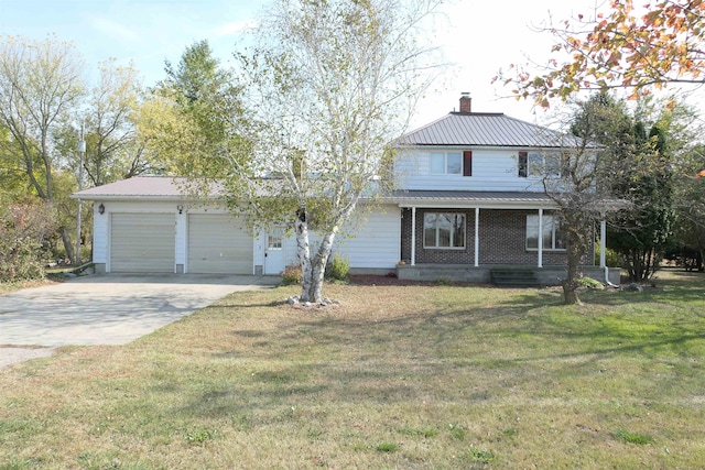 view of front facade featuring covered porch, a garage, and a front yard