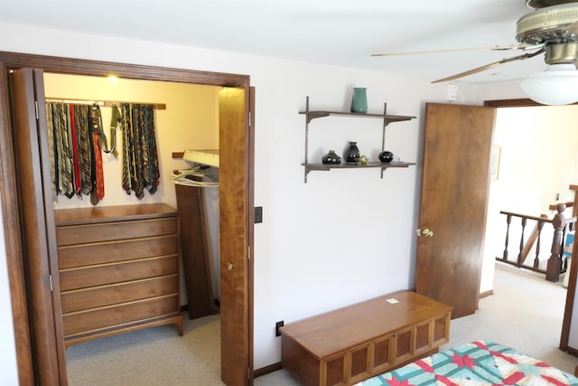 carpeted bedroom featuring a closet and ceiling fan