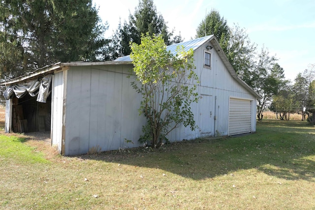 exterior space with a lawn and a garage