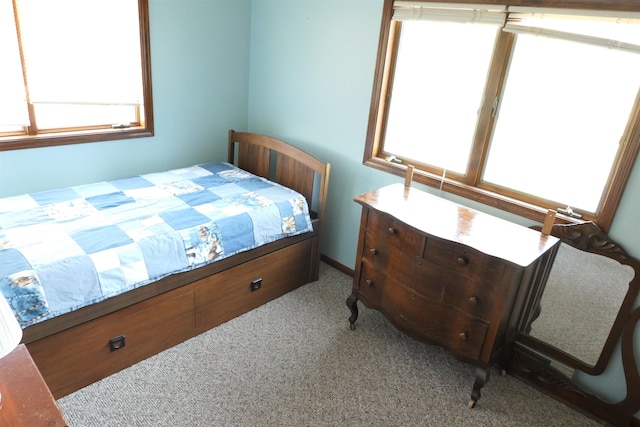 bedroom with light colored carpet