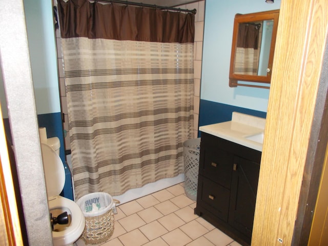 61776 Youngman Rd, Three Rivers, MI 49093 - full bathroom featuring vanity, toilet, tile patterned flooring, and curtained shower