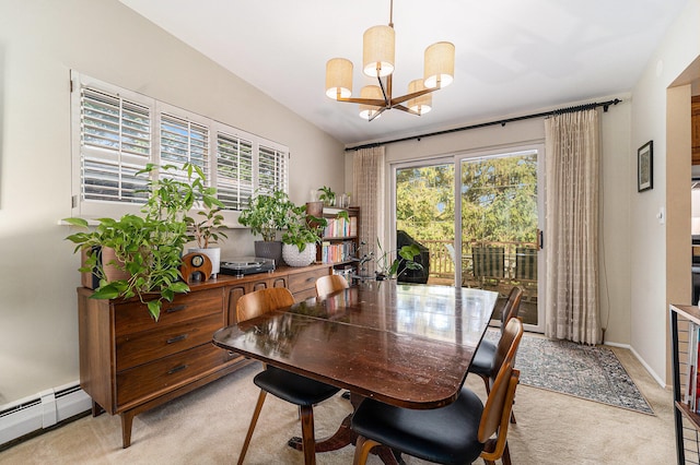 carpeted dining room featuring a chandelier and a baseboard radiator