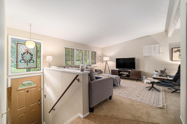 living room featuring light carpet and vaulted ceiling