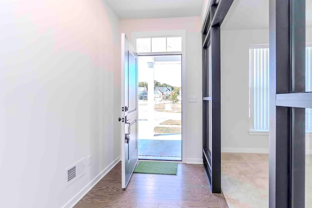 doorway to outside with dark hardwood / wood-style floors