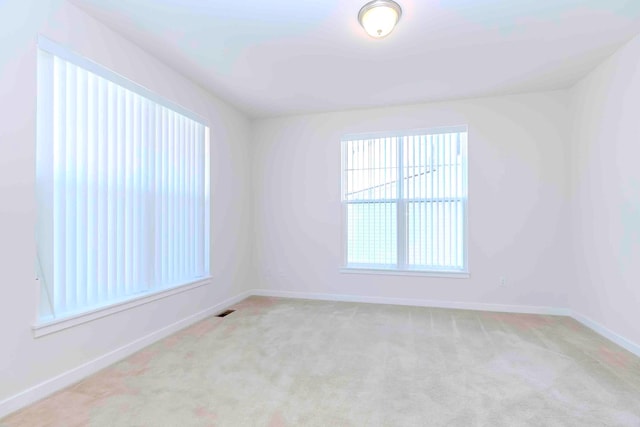 empty room with light colored carpet