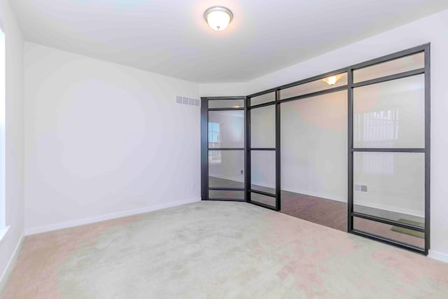 unfurnished room with carpet