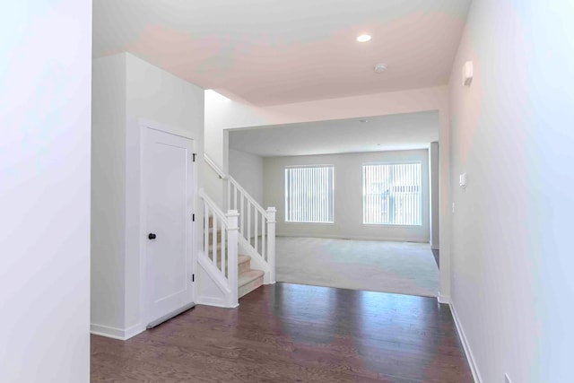 corridor with dark wood-type flooring