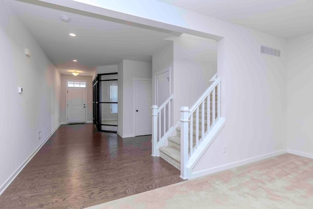 foyer entrance featuring dark hardwood / wood-style flooring