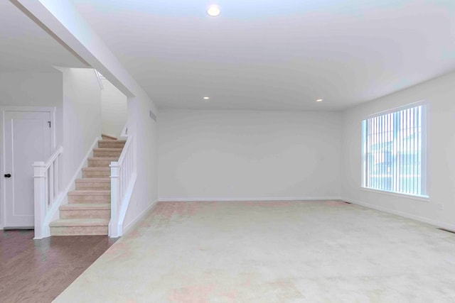 unfurnished living room featuring hardwood / wood-style flooring