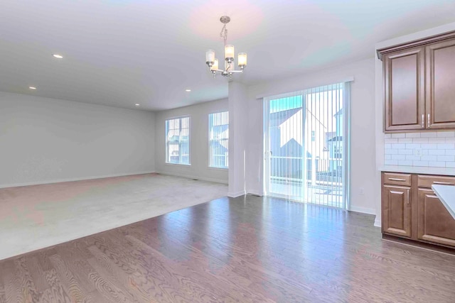 interior space featuring hardwood / wood-style floors and a notable chandelier