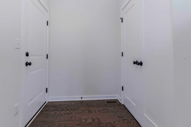 laundry area featuring dark hardwood / wood-style floors