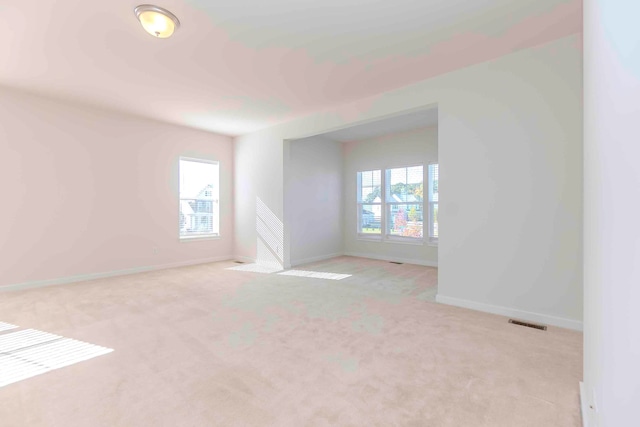 empty room featuring light colored carpet