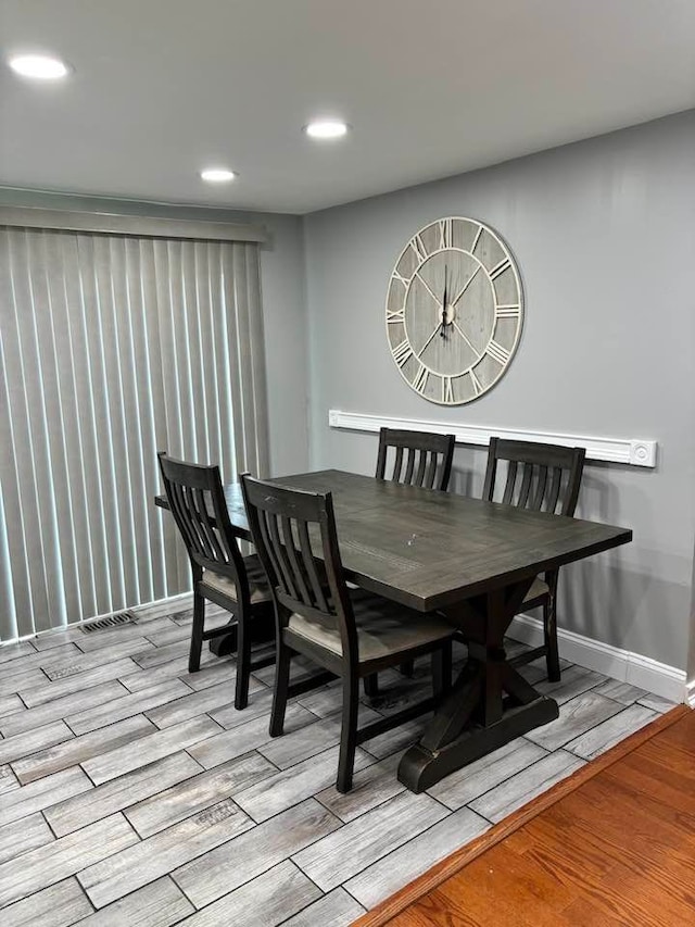 dining room with light hardwood / wood-style flooring