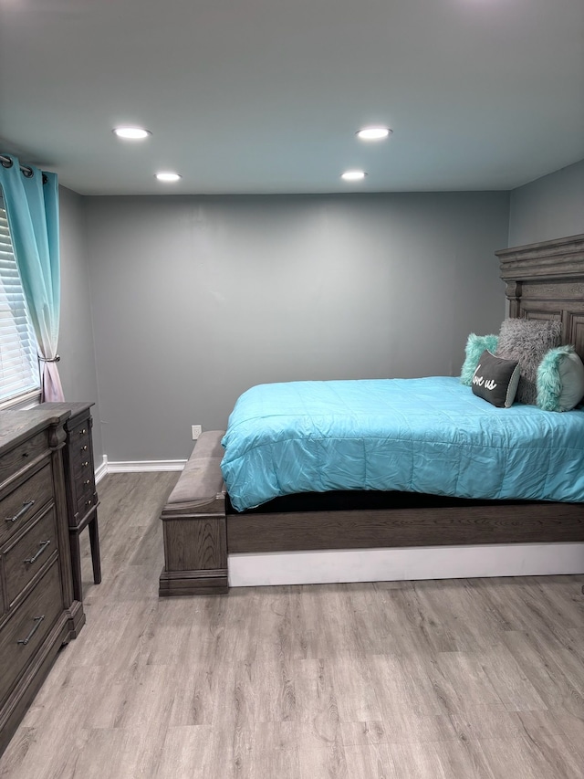 bedroom with light wood-type flooring