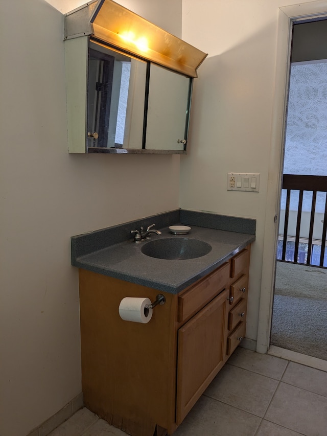 bathroom featuring tile patterned floors and vanity