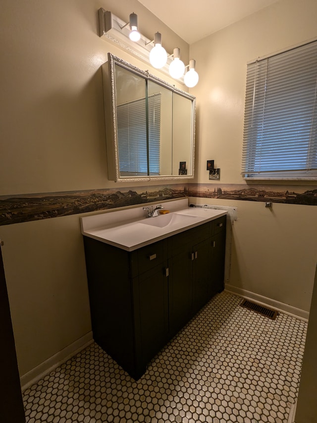 bathroom with tile patterned flooring and vanity