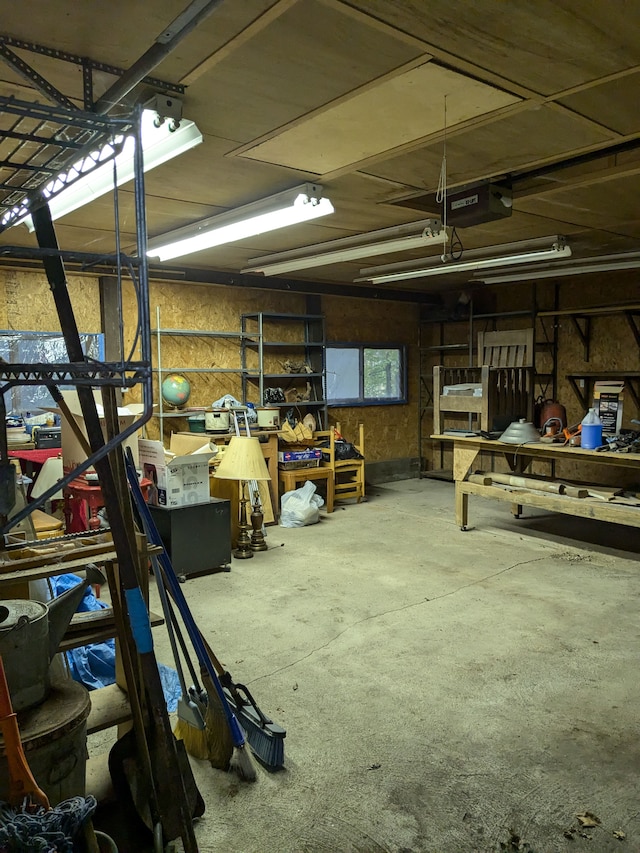 interior space with a workshop area and a garage door opener