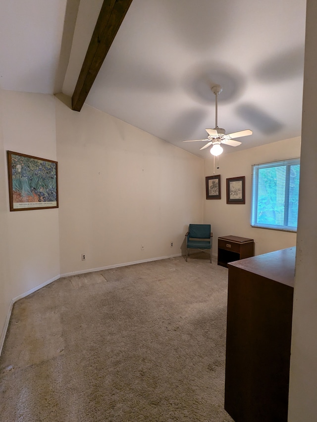 carpeted office space with vaulted ceiling with beams and ceiling fan