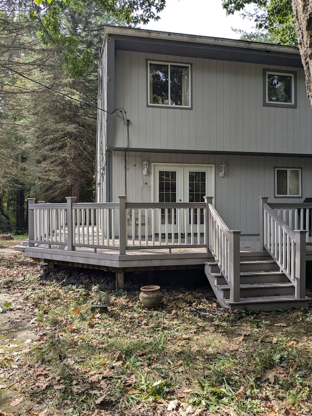 rear view of house with a wooden deck