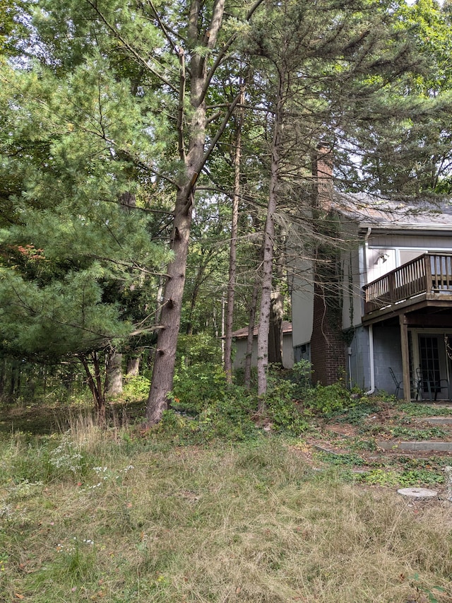 view of property exterior featuring a deck