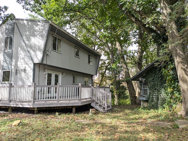 back of house featuring a deck