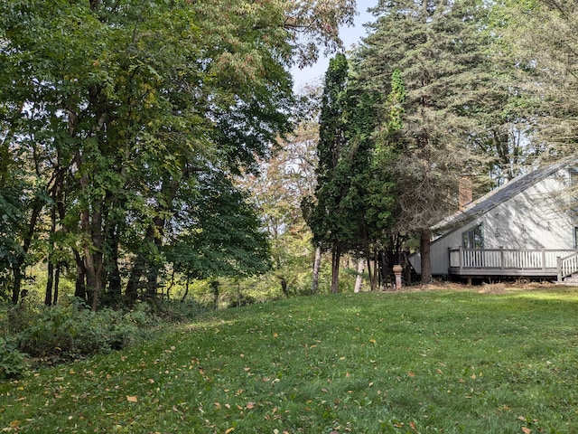 view of yard with a wooden deck