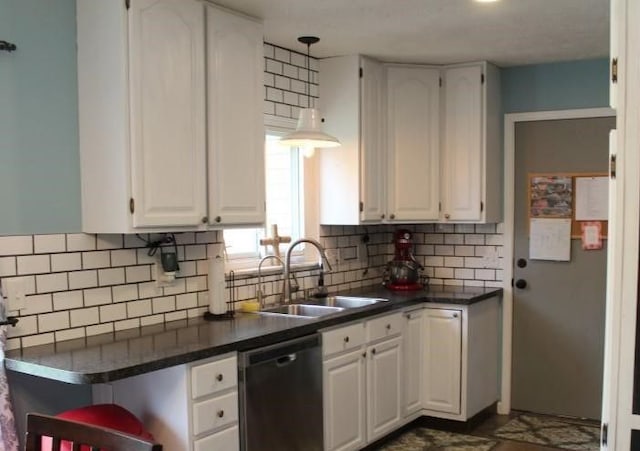 kitchen with backsplash, sink, white cabinets, and black dishwasher