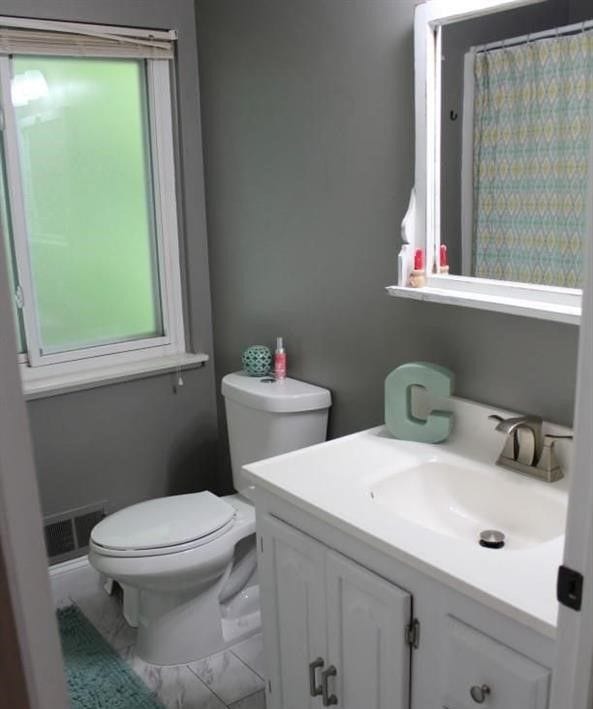 bathroom with vanity and toilet