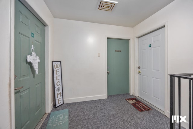 view of carpeted foyer