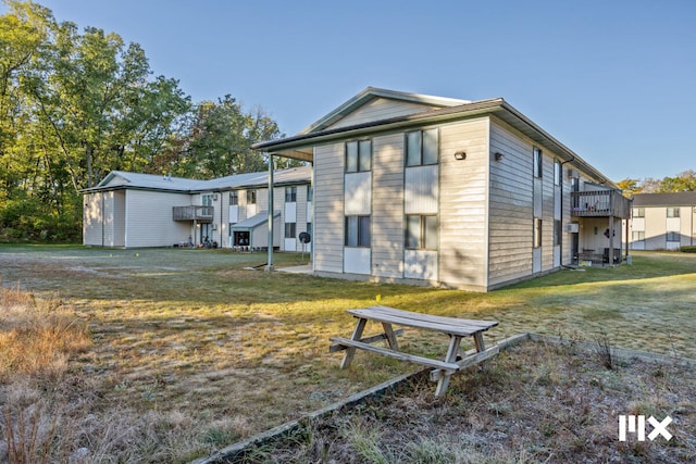 view of side of property with a yard