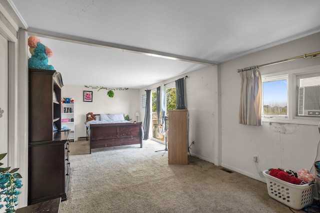 carpeted bedroom featuring multiple windows