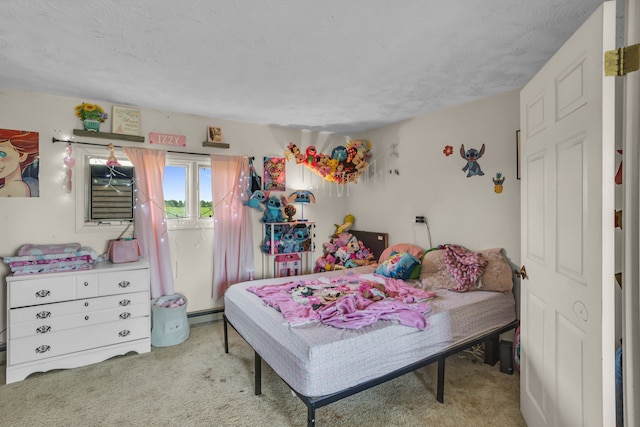 bedroom with light colored carpet, a textured ceiling, and a baseboard radiator