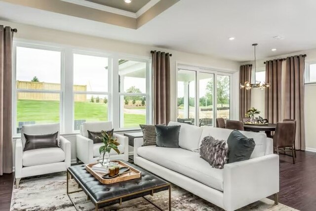 sunroom / solarium with a notable chandelier