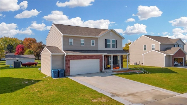 view of property featuring a front yard and a garage