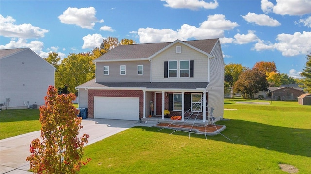 view of property with a garage and a front lawn