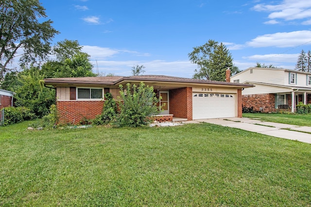 ranch-style house featuring a garage and a front yard