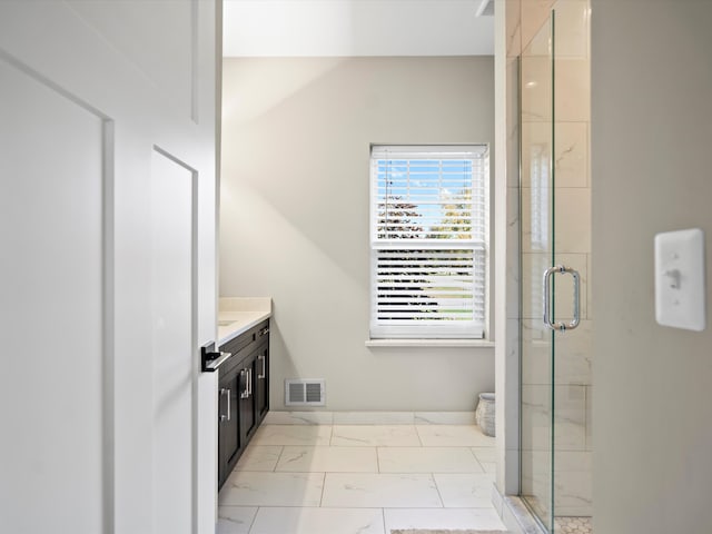 bathroom with vanity and an enclosed shower