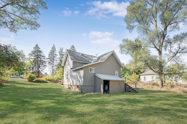 view of home's exterior with a yard