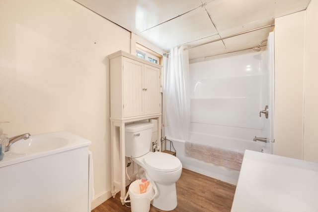 full bathroom featuring toilet, vanity, shower / bath combination with curtain, and hardwood / wood-style flooring