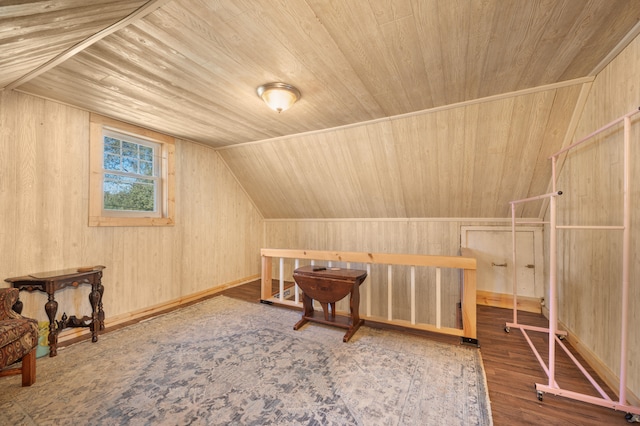 bonus room featuring wood-type flooring, wood walls, lofted ceiling, and wood ceiling