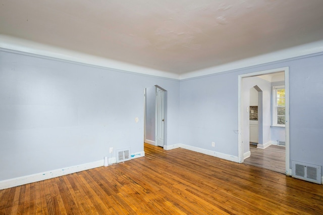 unfurnished room featuring dark hardwood / wood-style floors